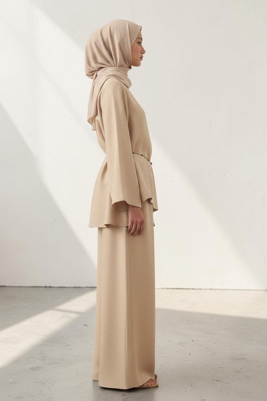Cherianne.com beige linen blouse with bell sleeves and waist tie paired with matching wide-leg trousers on a model
