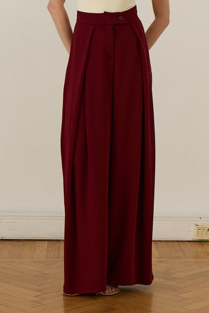 Cherianne.com high-waisted burgundy wide-leg trousers with pleated ruffle detail and side pockets