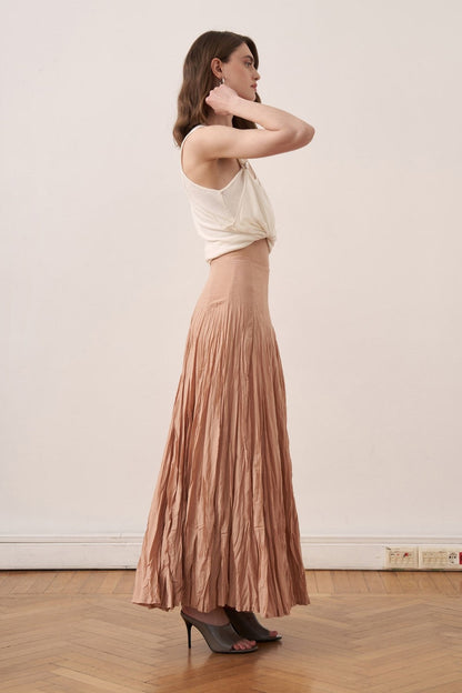 Cherianne.com Tyra maxi skirt in crushed cotton voile with a high-waisted paneled design in a soft nude tone.