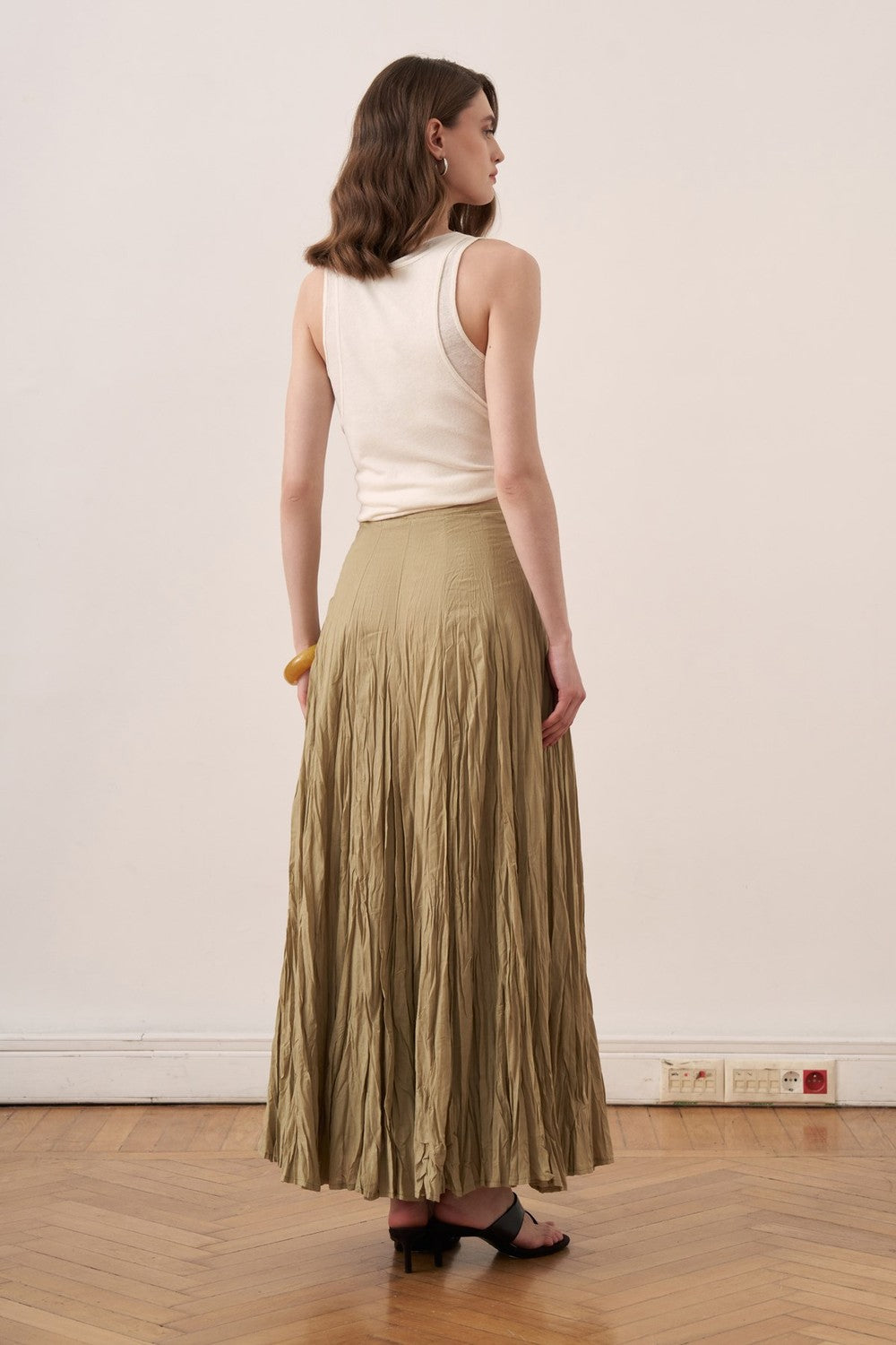Cherianne.com olive green cotton voile maxi skirt with a crushed crinkle texture and high-waisted paneled design.