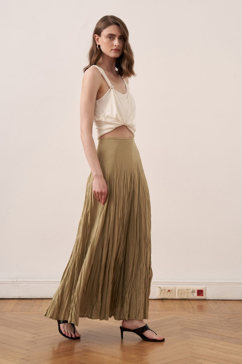 Cherianne.com olive green cotton voile maxi skirt with a crushed crinkle texture and high-waisted paneled design.