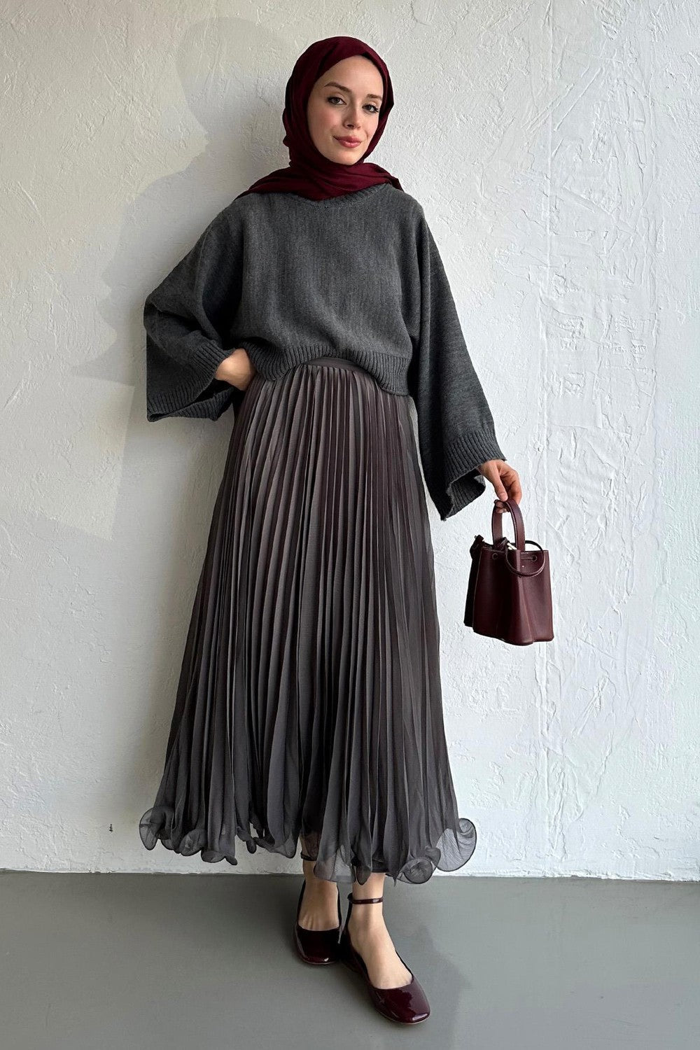 Cherianne.com gray pleated chiffon maxi skirt paired with a dark gray sweater and burgundy hijab and handbag