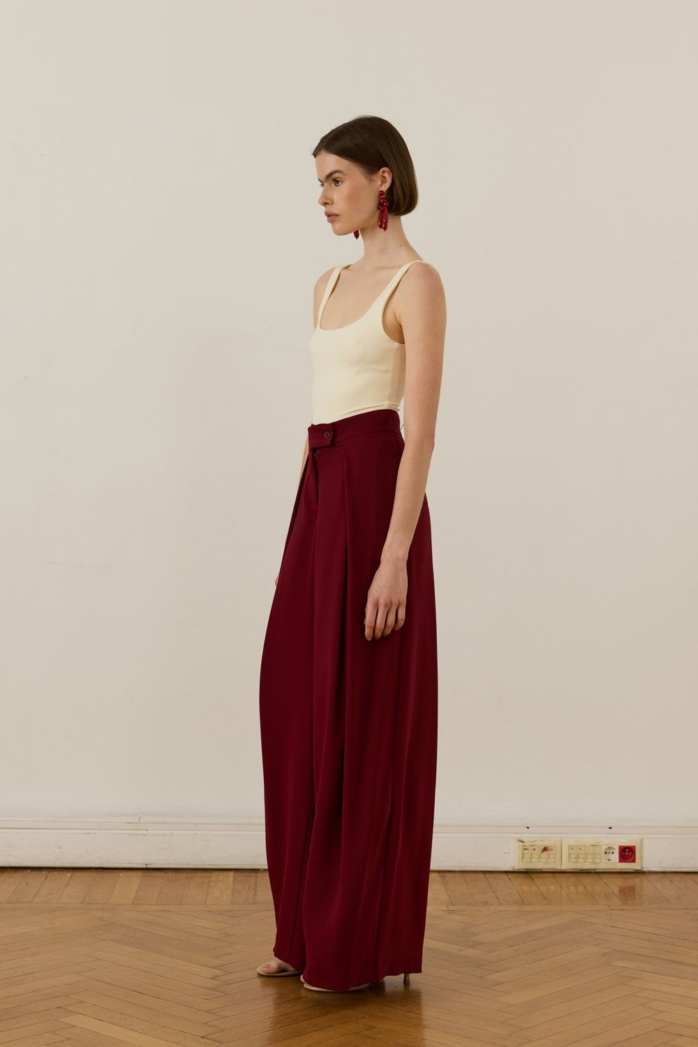 Cherianne.com high-waisted burgundy wide-leg trousers with pleated ruffle detail and side pockets