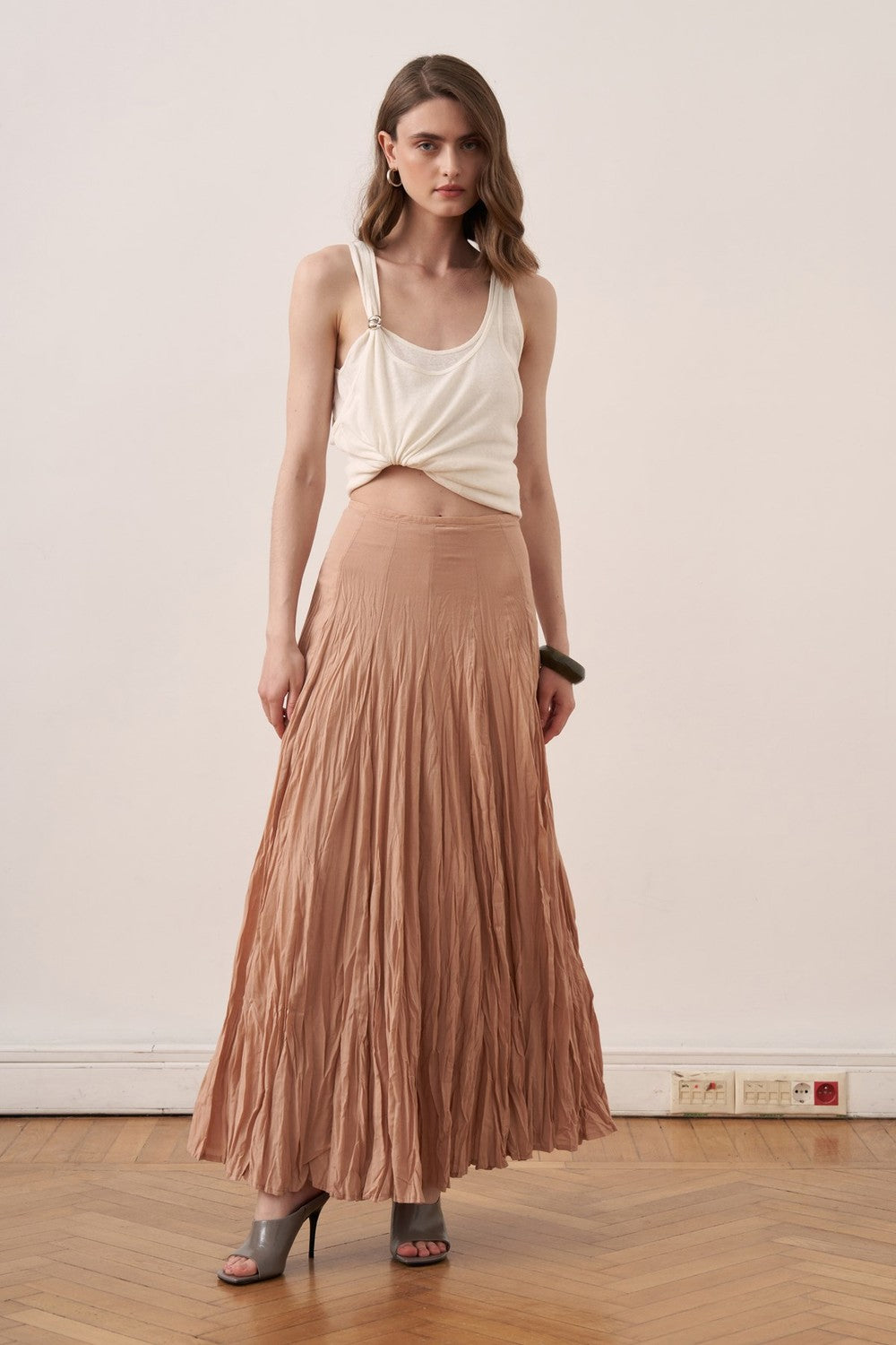 Cherianne.com Tyra maxi skirt in crushed cotton voile with a high-waisted paneled design in a soft nude tone.