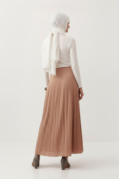 Cherianne.com Tyra maxi skirt in beige cotton voile with a pleated crush texture, worn by a model from behind.