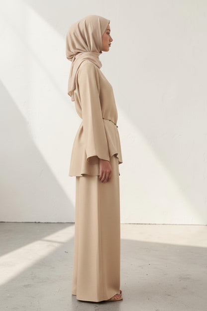 Cherianne.com beige linen blouse with bell sleeves and waist tie paired with matching wide-leg trousers on a model
