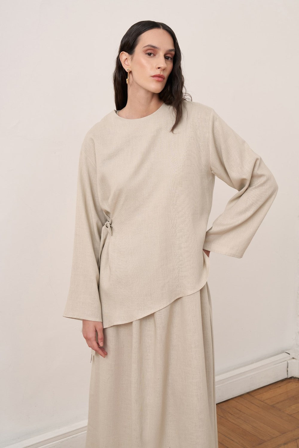 Cherianne.com beige linen two-piece dress set featuring an asymmetric long-sleeve tunic and a sleeveless maxi dress.