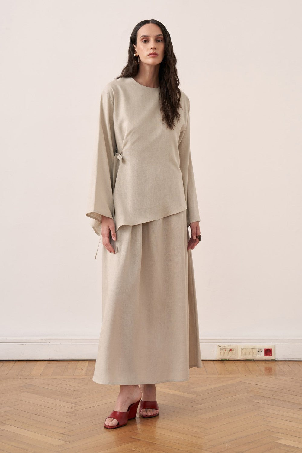 Cherianne.com beige linen blend two-piece dress set featuring a sleeveless maxi dress and an asymmetric side-tie tunic