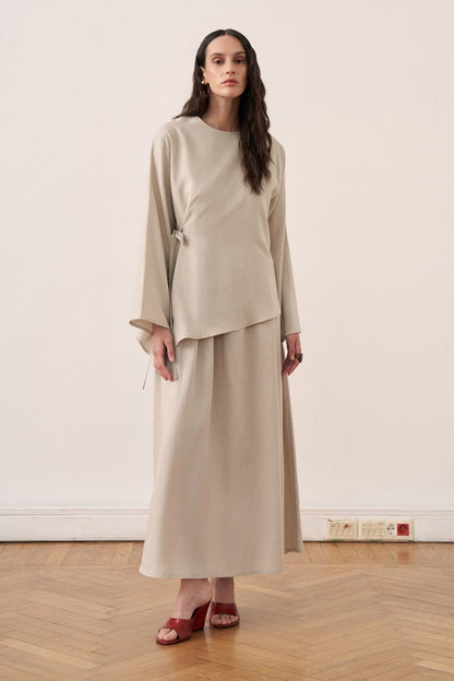 Cherianne.com beige linen blend two-piece dress set featuring a sleeveless maxi dress and an asymmetric side-tie tunic