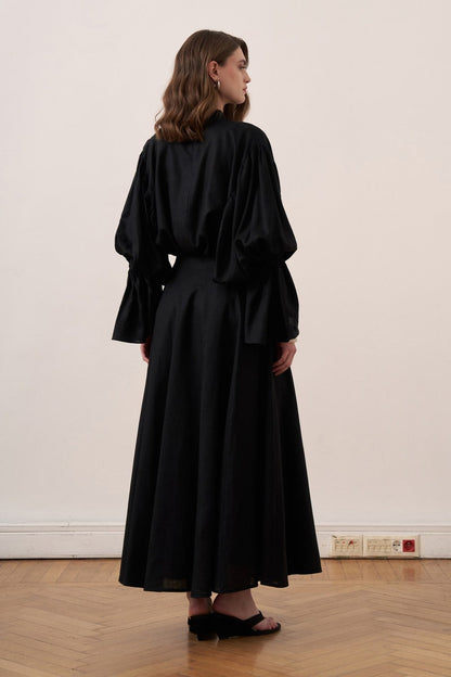 Cherianne.com black linen blend blouse with voluminous balloon sleeves and a minimalist gathered mock neck collar.