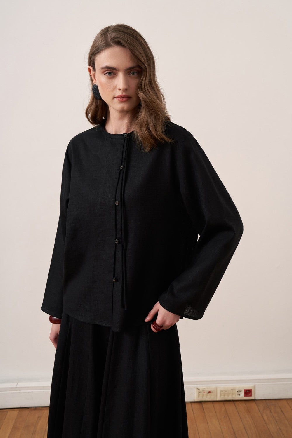 Cherianne.com black linen blend shirt with mandarin collar, asymmetric button placket, and relaxed drop shoulder fit.