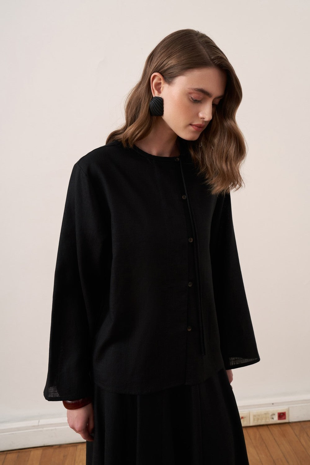 Cherianne.com black linen blend shirt with mandarin collar, asymmetric button placket, and relaxed drop shoulder fit.