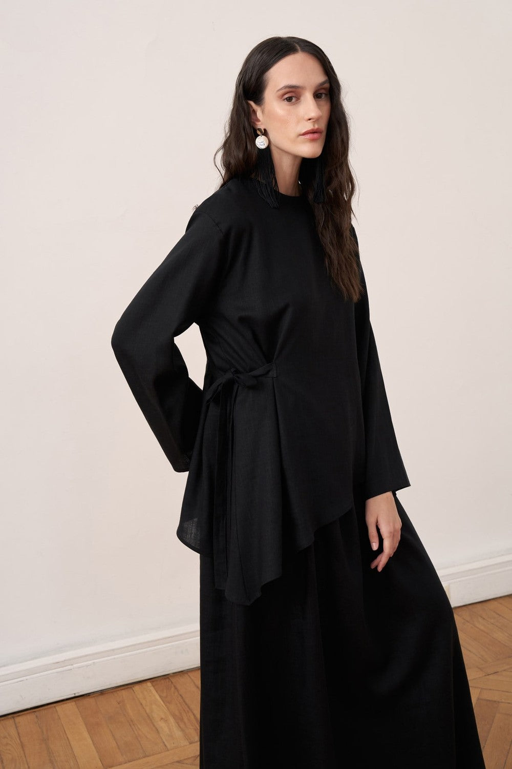 Cherianne.com black two-piece linen blend dress set featuring an asymmetric long-sleeve tunic with side tie detail.