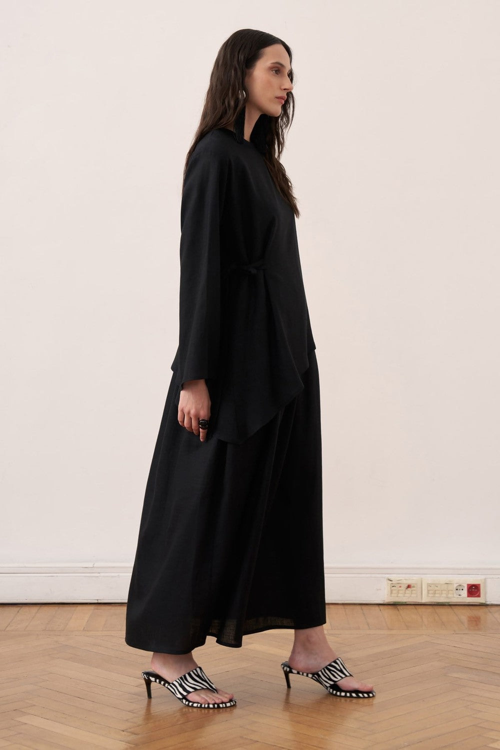 Cherianne.com black two-piece linen blend dress set featuring a sleeveless maxi dress and an asymmetric side-tie tunic