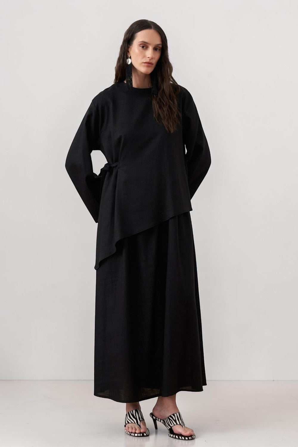Cherianne.com black two-piece linen blend dress set featuring a sleeveless maxi dress and asymmetric side-tie tunic.
