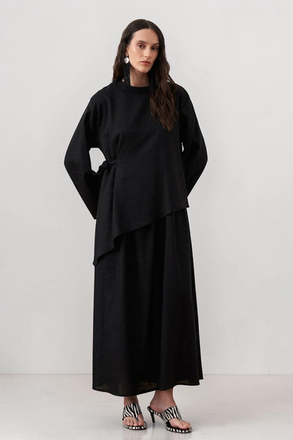 Cherianne.com black two-piece linen blend dress set featuring a sleeveless maxi dress and asymmetric side-tie tunic.