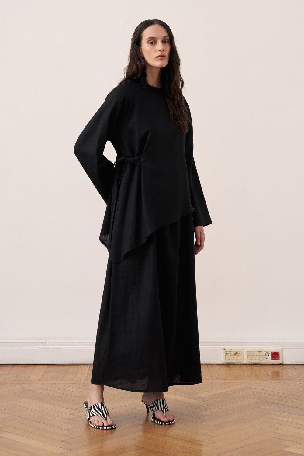 Cherianne.com black two-piece linen blend dress set featuring a sleeveless maxi dress and asymmetric side-tie tunic.