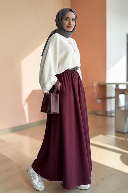 Cherianne.com burgundy flared poplin maxi skirt with pockets, styled with a white sweater and sneakers