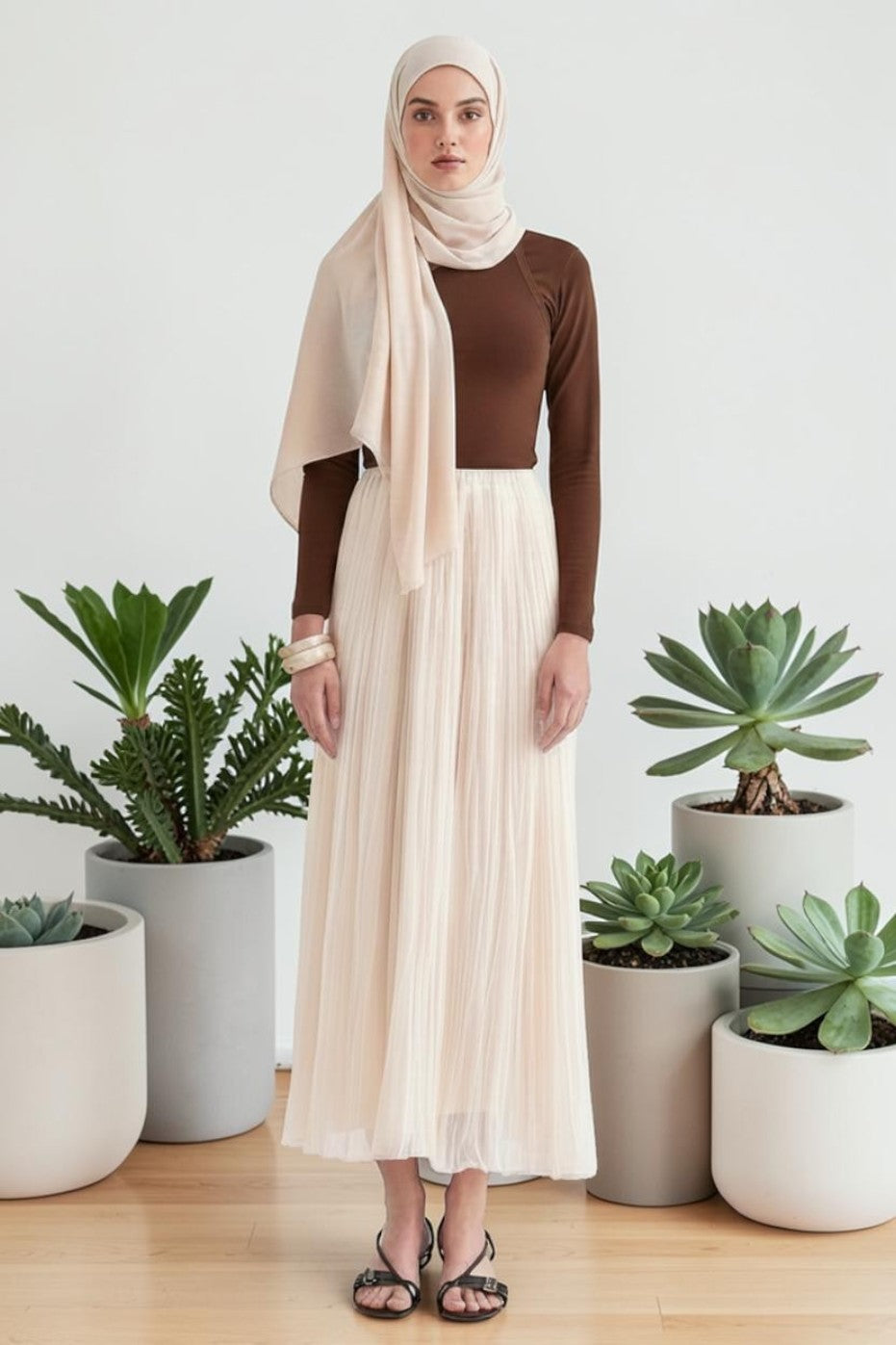 Cherianne.com ecru crush chiffon maxi skirt with elastic waist, worn by a model in a brown top and matching hijab.