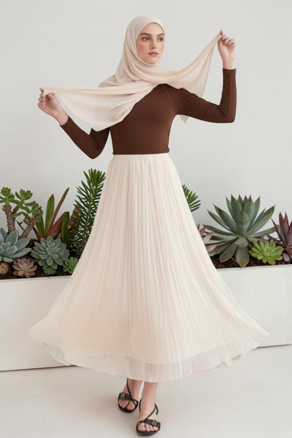 Cherianne.com ecru crush chiffon skirt with elastic waist, worn by a model with a brown top and matching hijab.