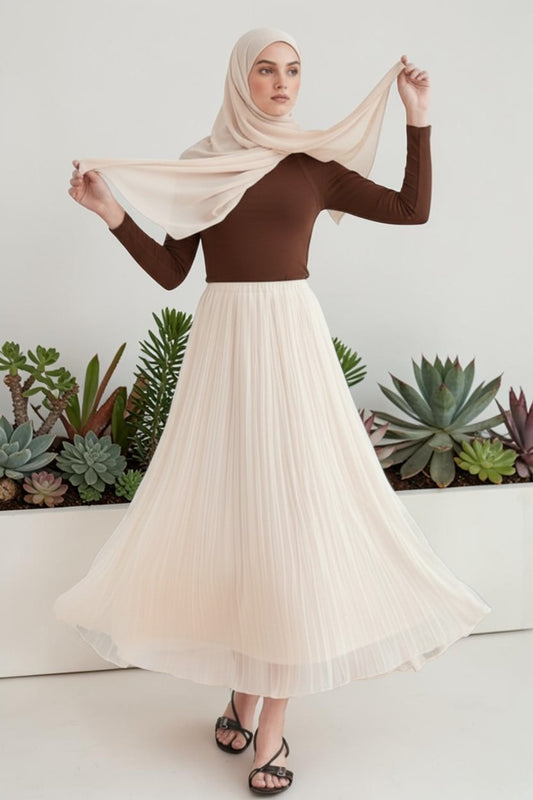 Cherianne.com ecru crush chiffon skirt with elastic waist, worn by a model with a brown top and matching hijab.