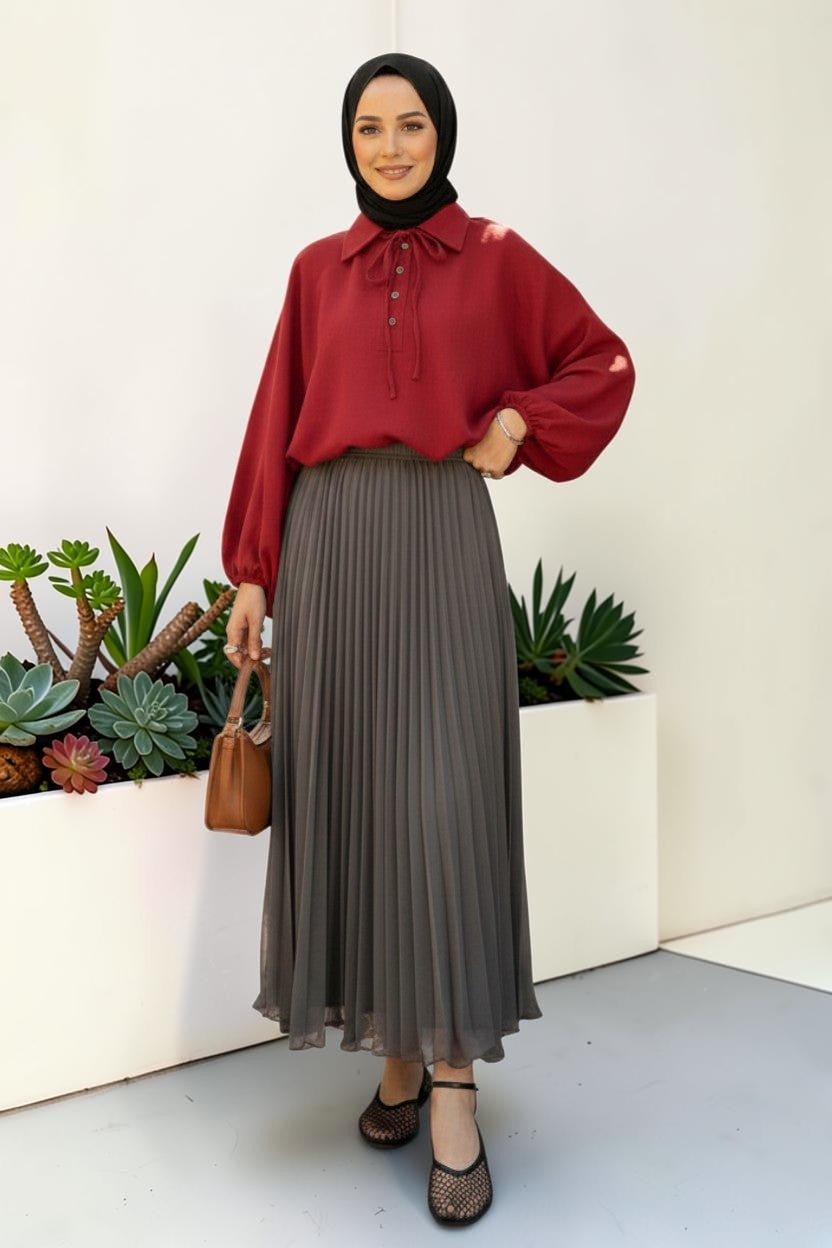 Cherianne.com gray pleated maxi chiffon skirt worn by a model with a red blouse and black hijab