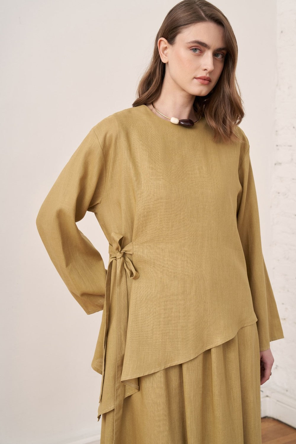 Cherianne.com mustard linen blend two-piece set featuring an asymmetric long-sleeve tunic with side tie detail.
