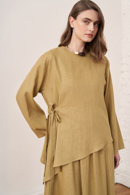 Cherianne.com mustard linen blend two-piece set featuring an asymmetric long-sleeve tunic with side tie detail.