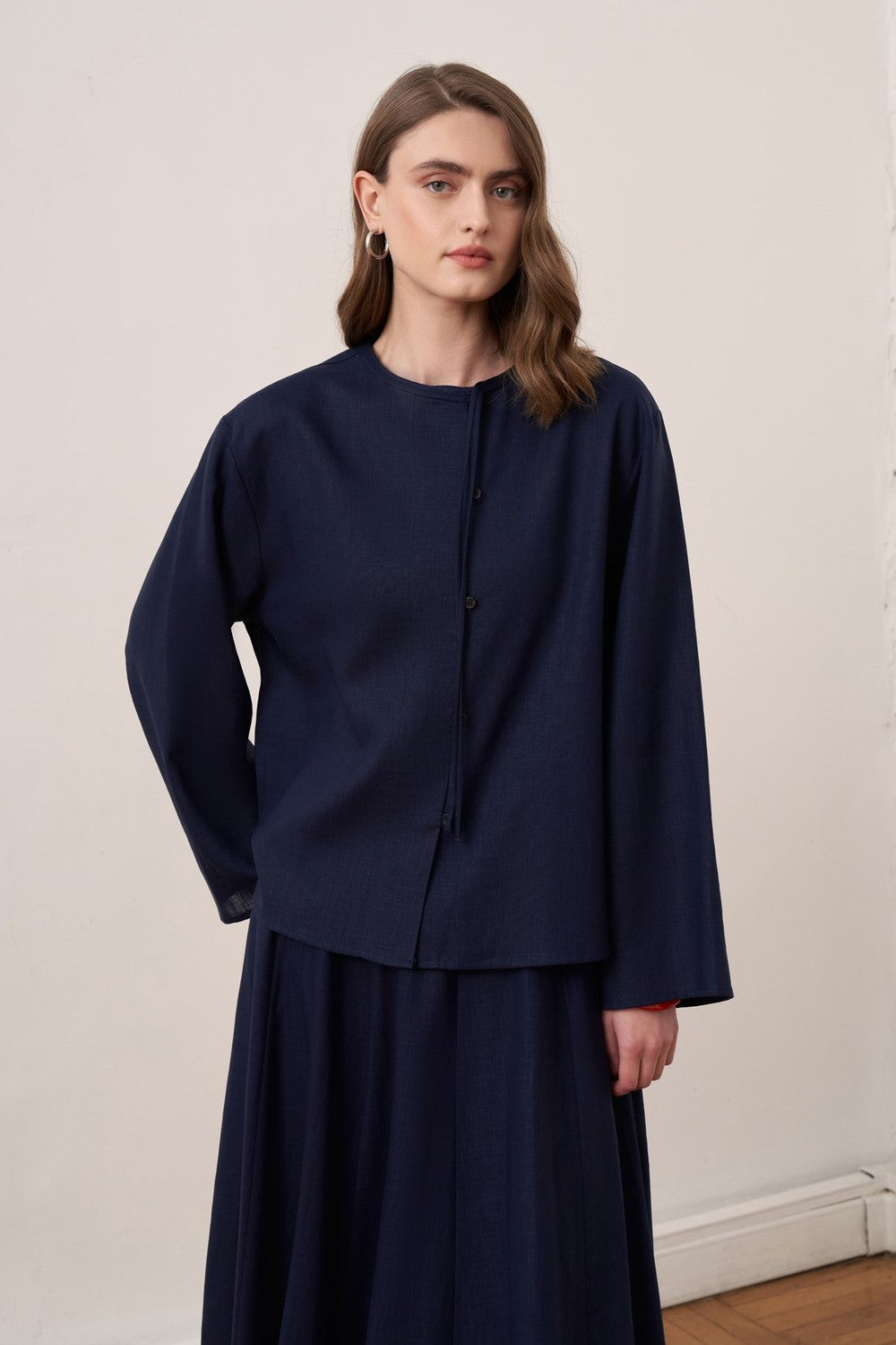 Cherianne.com navy blue linen blend shirt and matching maxi skirt worn by a model from the back view