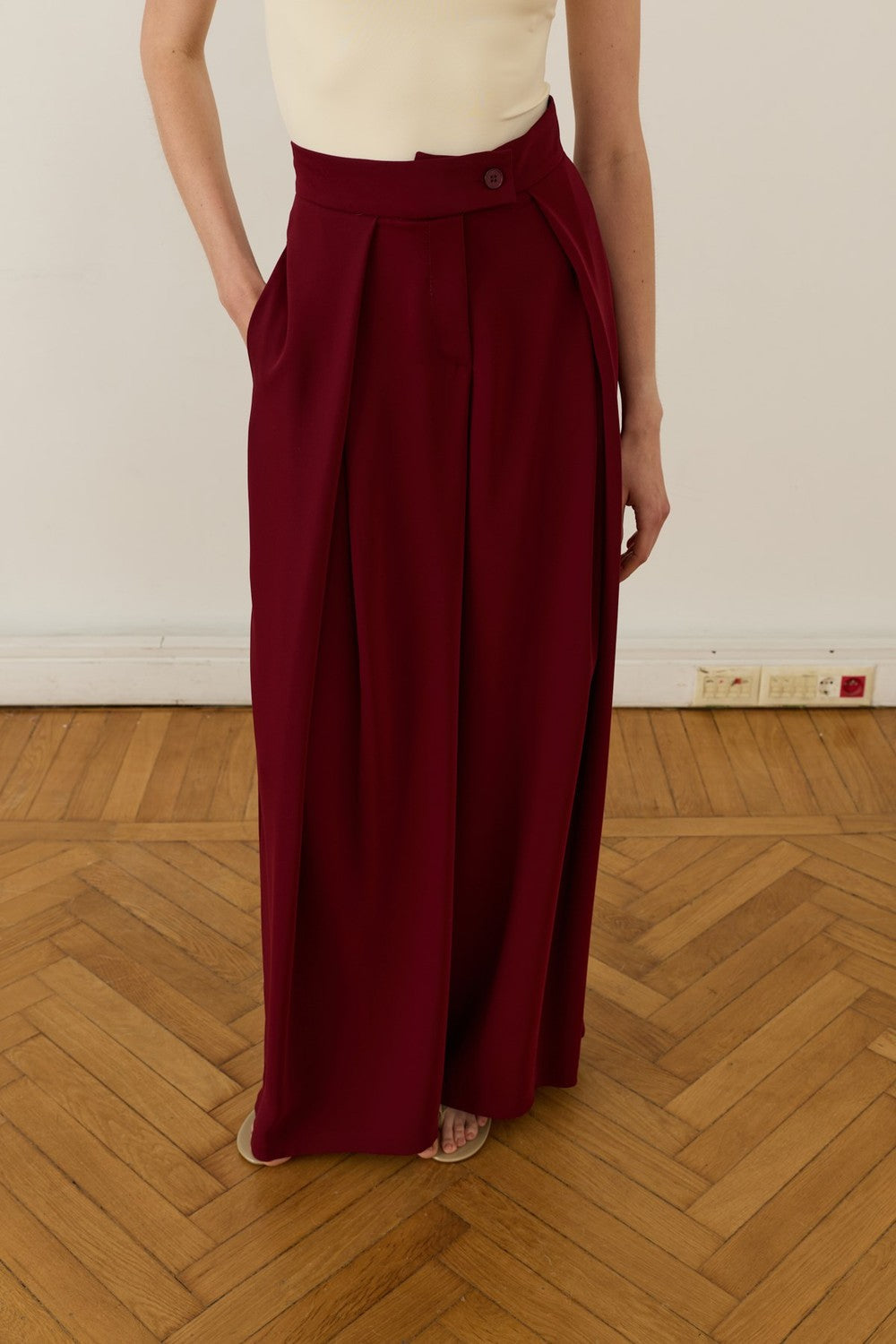 Cherianne.com high-waisted burgundy wide-leg trousers with pleated ruffle detail and side pockets