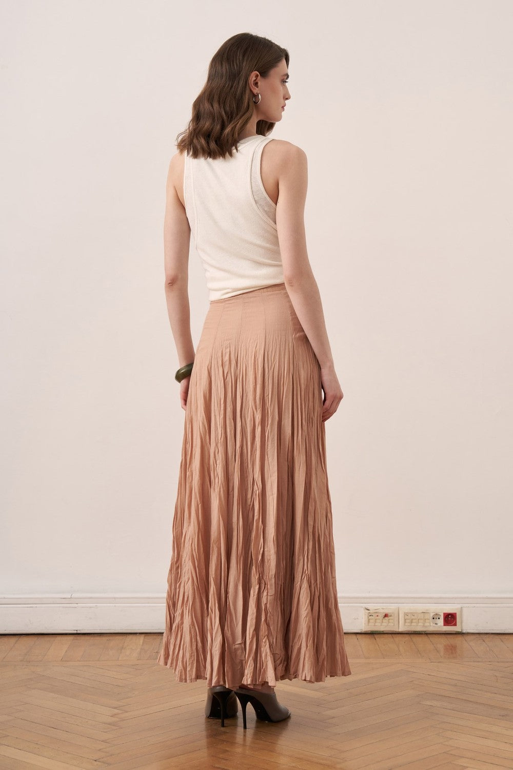 Cherianne.com Tyra maxi skirt in crushed cotton voile with a high-waisted paneled design in a soft nude tone.